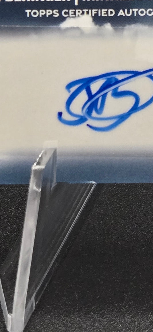 Close-up of a Topps trading card packaging with a clear plastic holder.