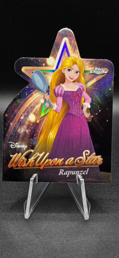 Star-shaped keychain with a character design on a dark background
