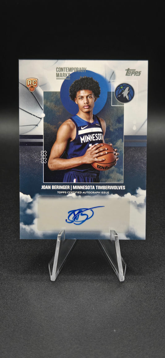 Basketball trading card with a player holding a ball, on a dark background