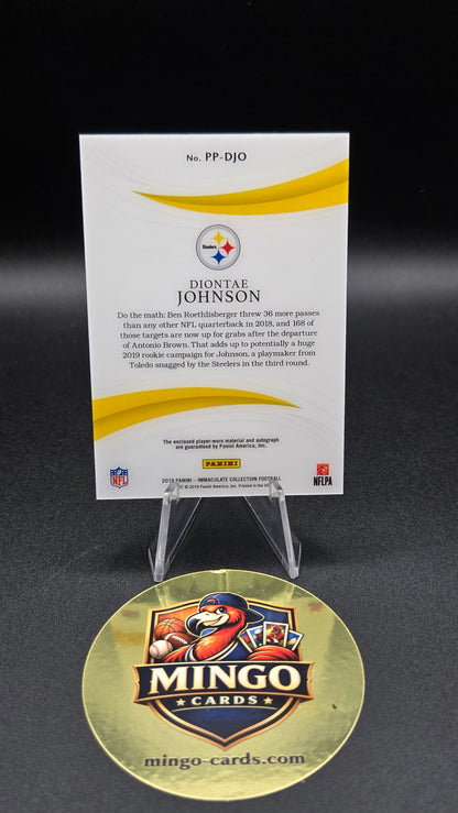 A Pittsburgh Steelers trading card in a clear display stand next to a round gold 'Mingo Cards' collectible coin on a black background.