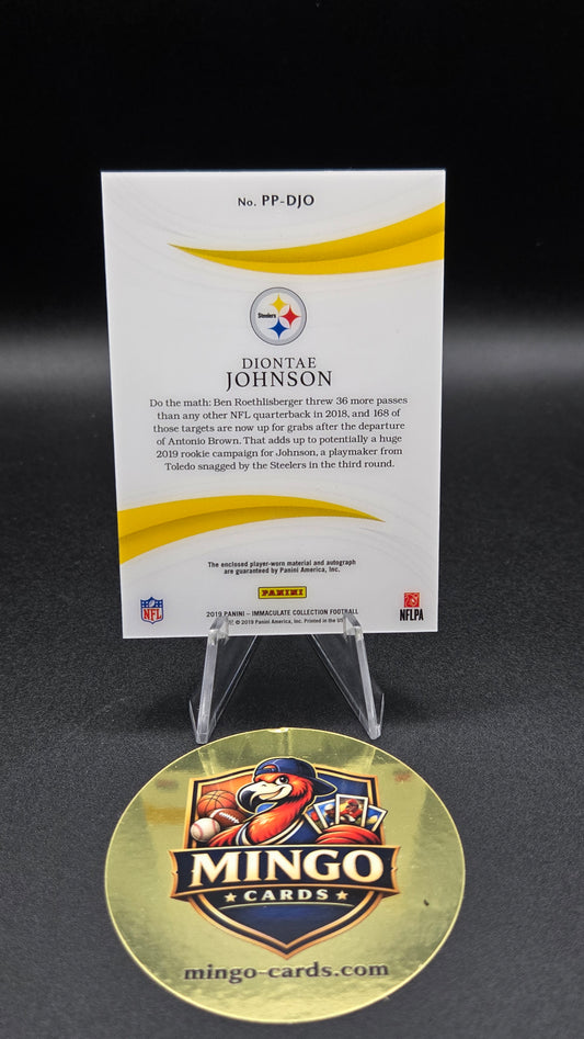 A Pittsburgh Steelers trading card in a clear display stand next to a round gold 'Mingo Cards' collectible coin on a black background.