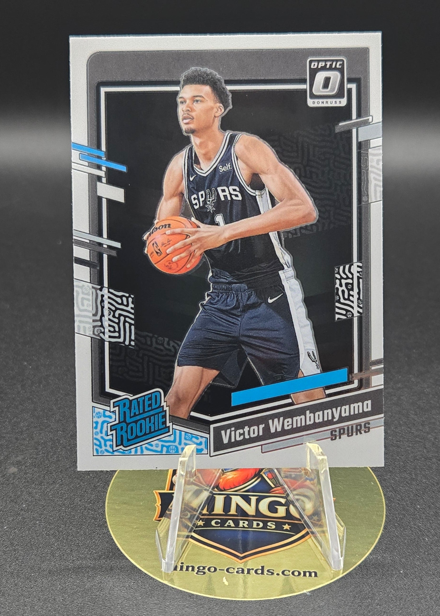 Basketball trading card with a player in action on a dark background
