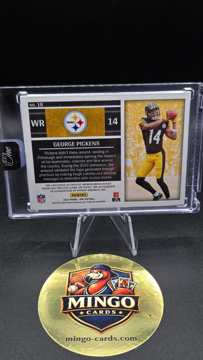 A collectible football trading card in a clear protective case, shown next to a round gold Mingo Cards logo medallion on a black background.
