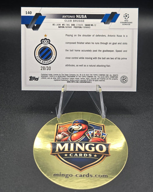 Card with player information of Antonio Nusa and a gold disc featuring a Club Brugge logo on a white background