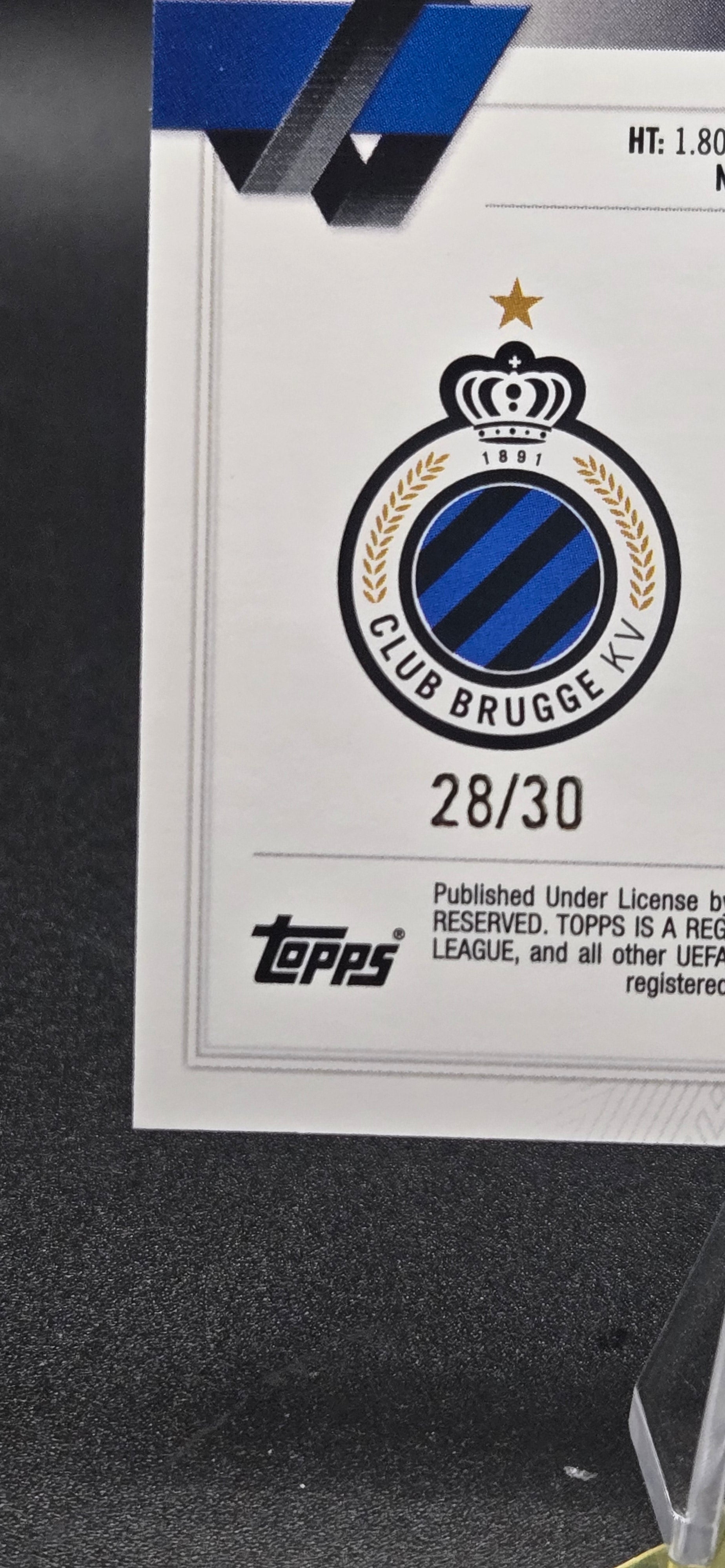 Trading card with a Club Brugge logo and text on a black background displaying 28/30 serialized card