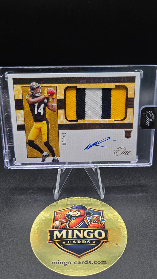 A collectible sports trading card in a clear protective case, displayed alongside a round gold Mingo Cards logo sticker on a black background. The card features a yellow and black jersey swatch, a player photo, and an autograph.